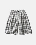 model wearing plaid cropped shorts streetwear