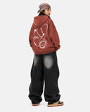 model wearing black baggy jeans back view