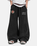 model wearing black washed barrel sweatpants front view