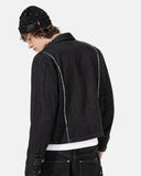 model wearing black cropped denim jacket back view