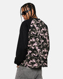 model back view wearing pink camo raglan sleeve t shirt