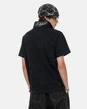 model back view wearing black embroidered polo t shirt