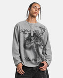 model wearing gray cross graphic long sleeve t shirt