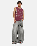 model styled in burgundy embroidered knit tank top for streetwear outfit