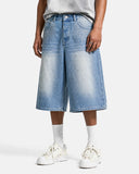 front view of rhinestone studded baggy jorts in light wash denim