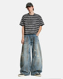 distressed denim jeans with dirty wash finish