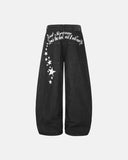 star graphic raw black barrel jeans front view