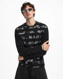 model upper body view in black long sleeve graphic tee