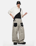 model front view wearing leopard print denim overalls with white sweatshirt