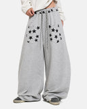 model wearing grey star graphic barrel sweatpants front view