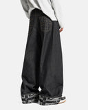 on-body side angle of dark denim baggy jeans