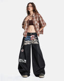 full-body streetwear styling with flag graphic barrel jeans