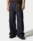 model wearing raw baggy jeans front view