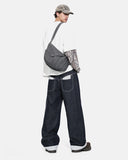 model wearing raw indigo jeans side view