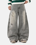 model wearing deconstructed barrel jeans