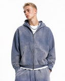 model wearing blue acid washed zip up hoodie
