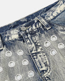 metal eyelet waist detail on washed jeans