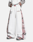 model wearing white striped graphic barrel sweatpants front view