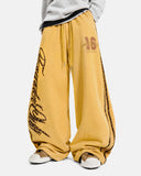 model wearing yellow leopard stripe baggy sweatpants