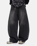 model wearing black washed barrel jeans front view