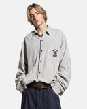 model wearing vintage striped embroidered shirt