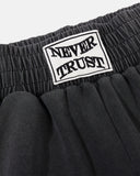 never trust waist patch detail on black sweatpants
