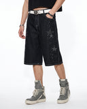 model wearing black rhinestone star baggy jorts