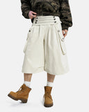 model wearing cream longline cargo shorts front view