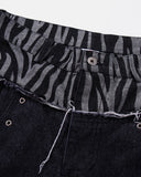 zebra pattern waistband detail on black jeans