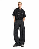 baggy tailored pants styled with belt and waffle shirt