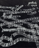close up of sheet music graphic print on long sleeve t shirt