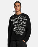 model upper body wearing black distressed script graphic tee
