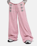 pink button detail wide leg sweatpants front view on model