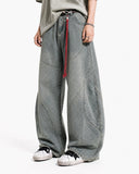 model wearing rope belt barrel jeans