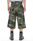 Washed camouflage shorts with utility side details and below-knee length
