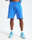 Model wearing washed sweat shorts with an oversized streetwear T-shirt