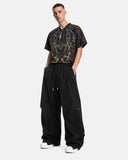 relaxed stretch parachute pants with structured cutting detail