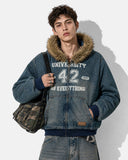 model wearing faux fur denim hooded jacket upper-body view