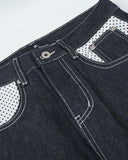 polka dot front pocket detail on raw denim jeans