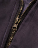 sleeve utility zipper detail on washed bomber jacket close-up