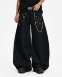 model wearing eyelet chain barrel jeans