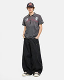full body outfit with gray polo shirt and wide leg pants