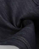 dark indigo raw denim texture close up