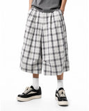 back view of grey white plaid shorts