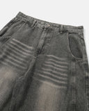 whisker wash detail on grey barrel jeans