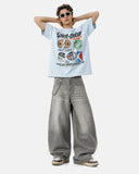 model full body outfit wearing oversized graphic t shirt with wide leg pants