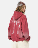 model wearing red washed 77 graphic hoodie back view