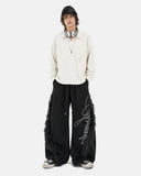 model front view in black faux fur trim sweatpants