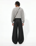 Back view male model wearing black baggy cargo pants