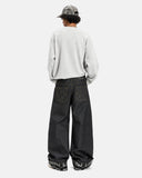 model wearing studded pocket baggy jeans back view